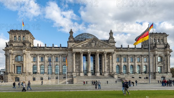 Reichstag with waving German flag