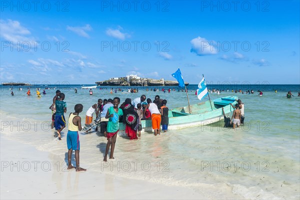 Busy beach filled with locals