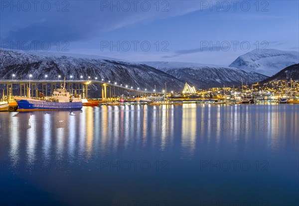 View over the harbour and city with Tromsobrua or Tromso Bridge