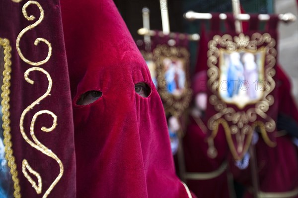 Penitent with traditional headgear