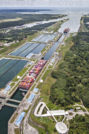 Aerial view of two Neo-Panamax container ships crossing the third set of locks at the pacific side