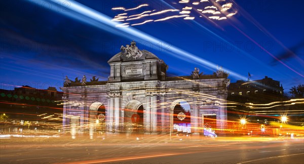 Puerta de Alcala with Christmas lights at dusk