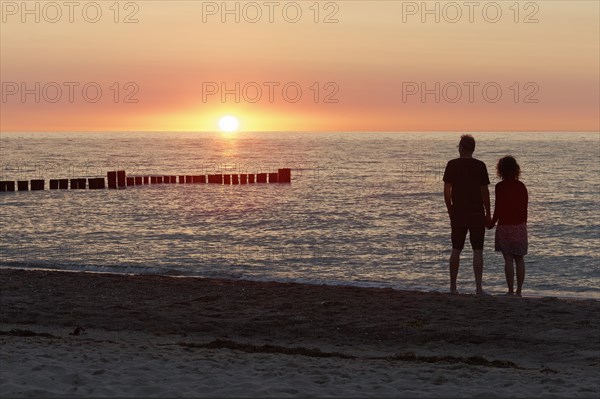 Couple holding hands