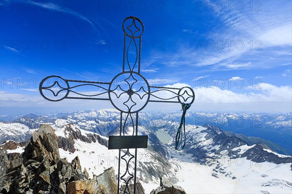 Summit cross Oberaarhorn with view of Oberaar glacier and Oberaar lake