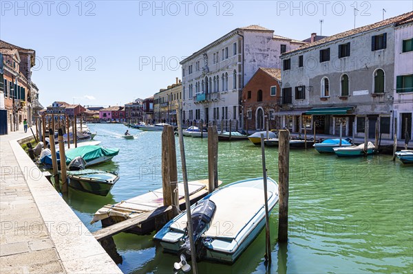 Houses and boats on the channel of Murano
