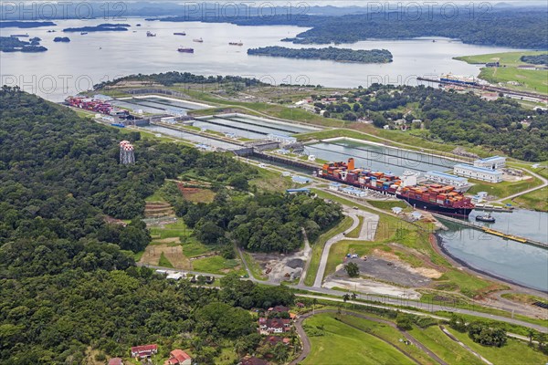 Aerial view of two Neo-Panamax container ships crossing the third set of locks at the pacific side
