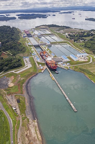 Aerial view of two Neo-Panamax container ships crossing the third set of locks at the pacific side