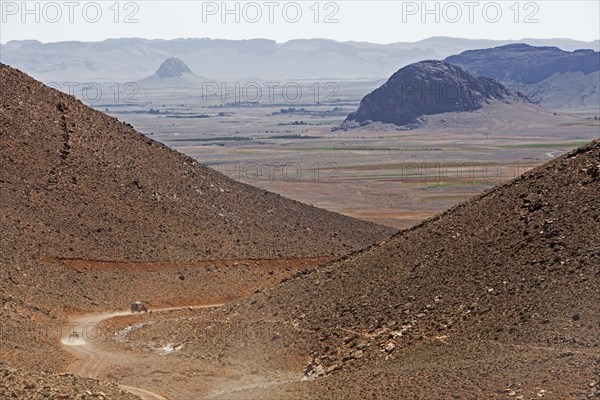 Off-road vehicle on the way to the Jbel Ban mountains in the plateau in the Anti-Atlas