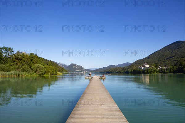 Bathing beach at the Fuschlsee with Fuschl Castle