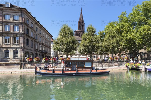 Historic boat on de Ill in front of the Palais Rohan