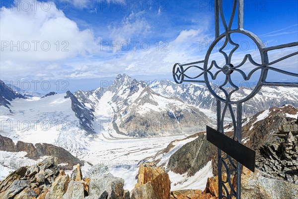 Oberaarhorn summit cross with view of Finsteraargletscher