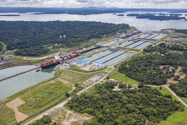 Aerial view of two Neo-Panamax container ships crossing the third set of locks at the pacific side