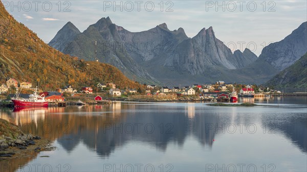 Wooden houses settlement on Reinefjord with fishing boats