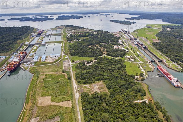 Aerial view of two Neo-Panamax container ships crossing the third set of locks at the pacific side