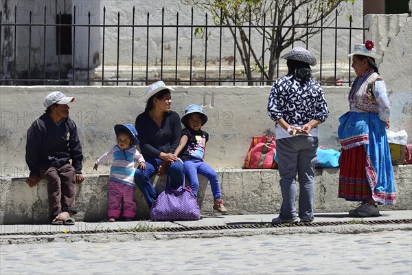 Locals chatting in front of the church