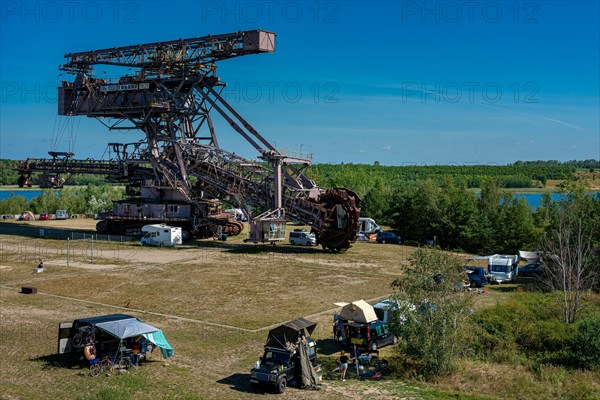 Camper at the bucket wheel excavator Mad Max in the open air museum Ferropolis