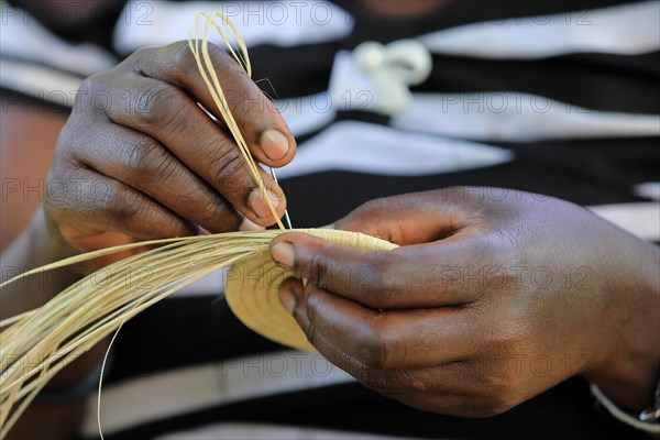 Woman weaving basket