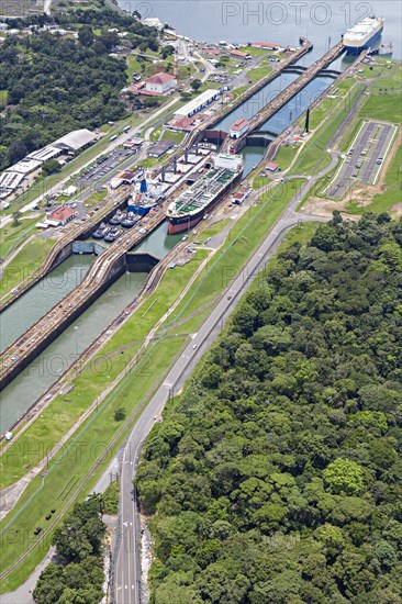 Gas and fuel tanker ships cross Gatun lock from the Pacific side