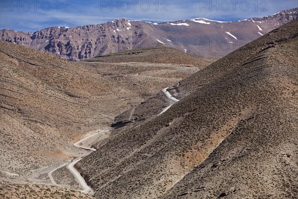 Off-road vehicle on gravel road to Mount Mgoun