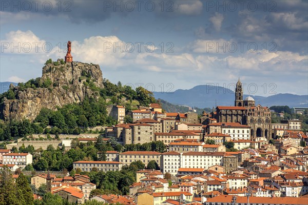 City view with statue of the Virgin Mary Notre Dame de France and cathedral