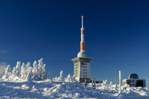 Transmitter mast and Brocken hostel on the winter snow-covered Brocken