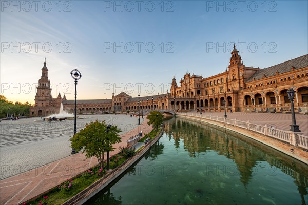 Plaza de Espana in the evening light with reflection in the canal