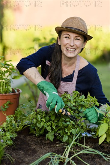 Woman doing gardening on a raised bed