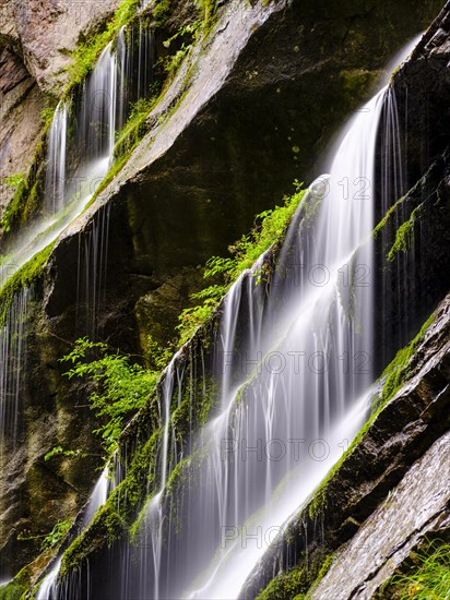 Waterfall on mossy rock face