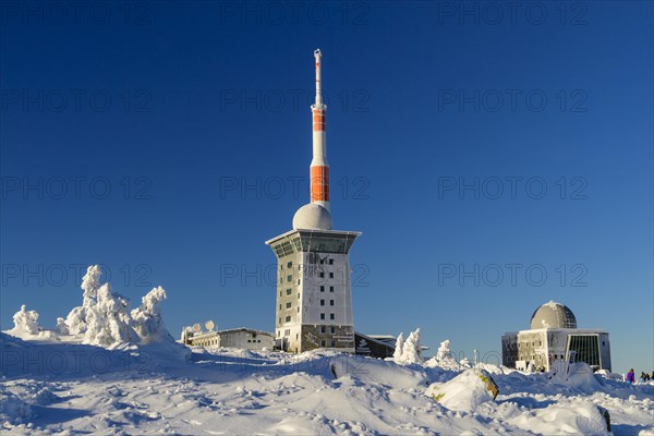 Transmitter mast and Brocken hostel on the winter snow-covered Brocken