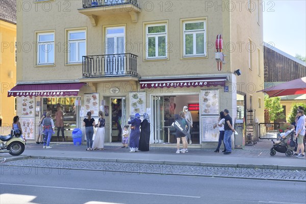 People queuing up in front of the ice cream parlor