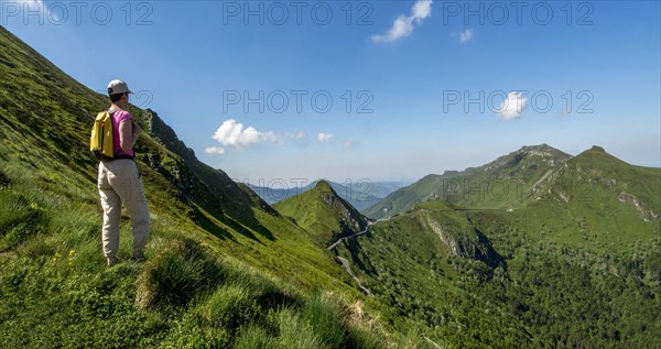 Hiker overlooking mountains