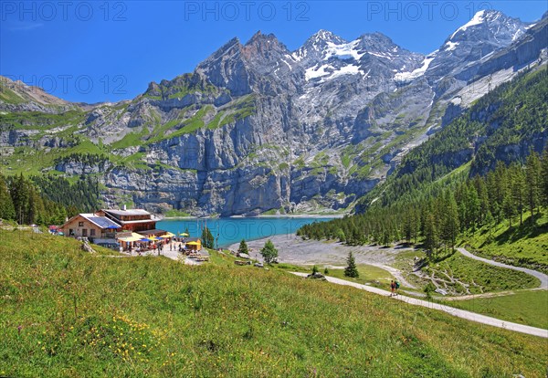 Oeschinensee with mountain inn and Blueemlisalp