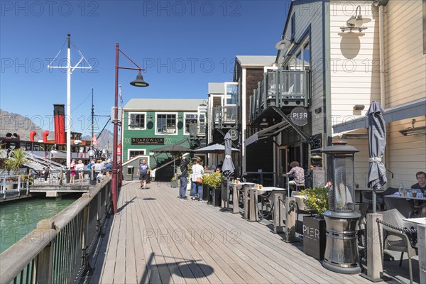 Boardwalk Seafood Restaurant at the jetty with historic steamer Earnslaw