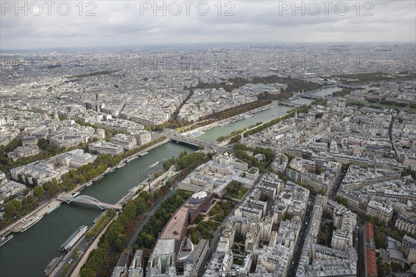 City view of Paris from the top of the Eiffel Tower overlooking the river Siene