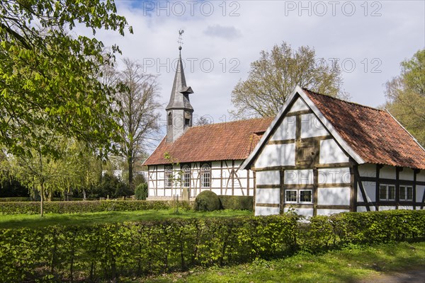 View of the church and village school with half-timbered houses in the museum village Cloppenburg