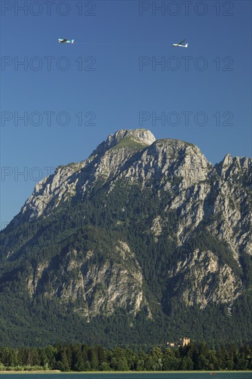 View over the Forgensee to Hohenschwangau Castle and the Tannheim mountains