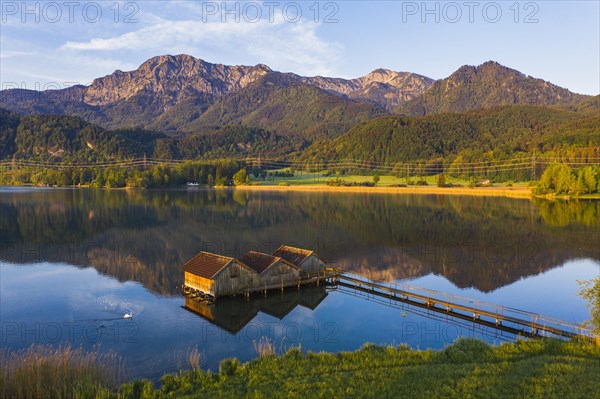 Boathouses in the Lake Kochel near Schlehdorf in the morning light