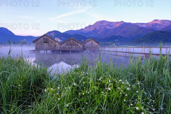 Boathouses in the Lake Kochel near Schlehdorf in the morning light