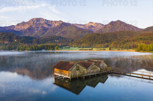 Boathouses in the Lake Kochel near Schlehdorf in the morning light