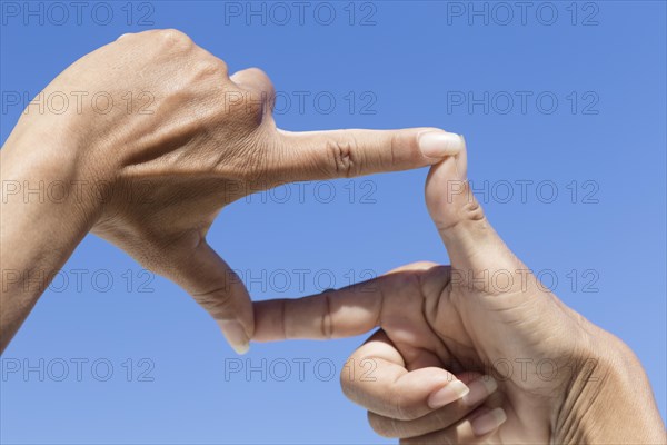 Girl making square shape with hands