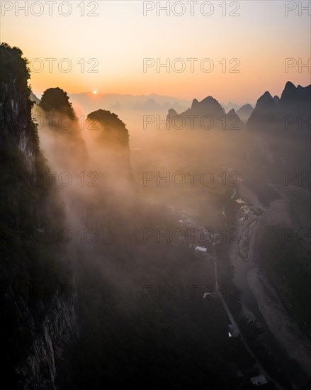 Chinese karst mountains at the Yangshuo River at sunrise