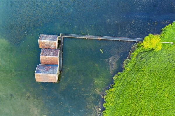 Boathouses in Lake Kochel near Schlehdorf from above