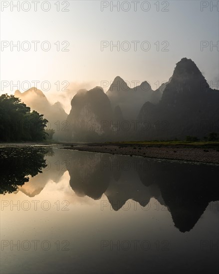 Chinese karst mountains at the Yangshuo River at sunrise