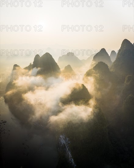Chinese karst mountains at the Yangshuo River at sunrise