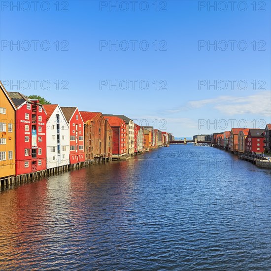 Colourful historic warehouses by the river Nidelva