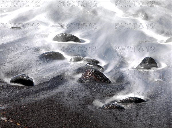 Black stones and sand