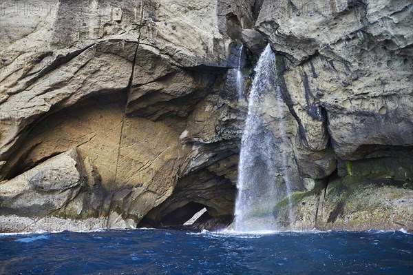 Steep coast with waterfall