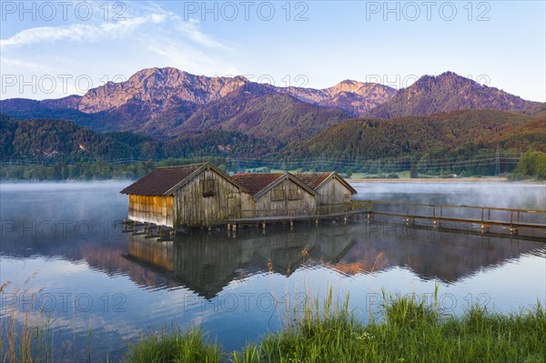 Boathouses in the Lake Kochel near Schlehdorf in the morning light