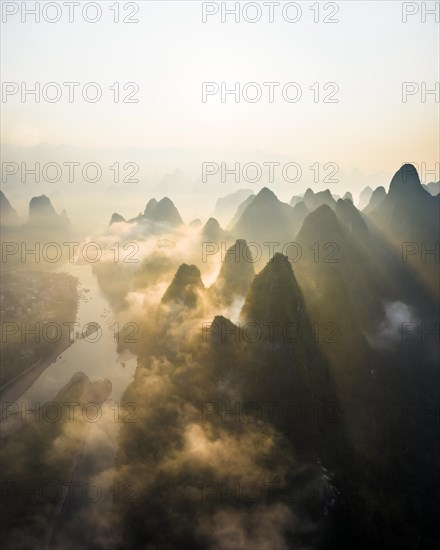 Chinese karst mountains at the Yangshuo River at sunrise