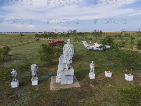 Aerial view on sculpural group Vladimir Lenin monuments in the Museum of Socialist Realism. Decommunization in Ukraine